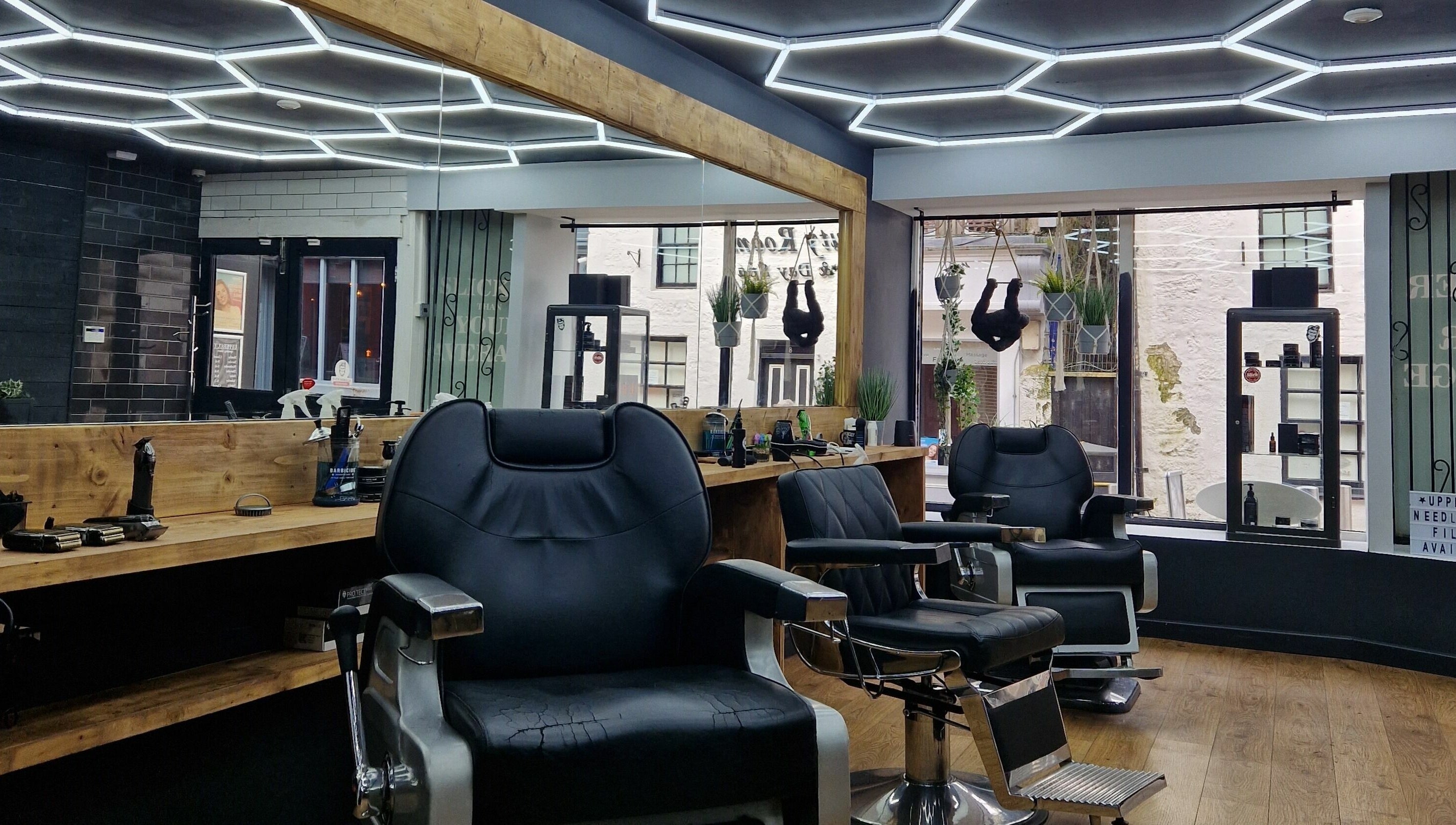 Sleek barber chairs at Uppercut, Kilsyth, Scotland, GB, showcasing contemporary interior design.