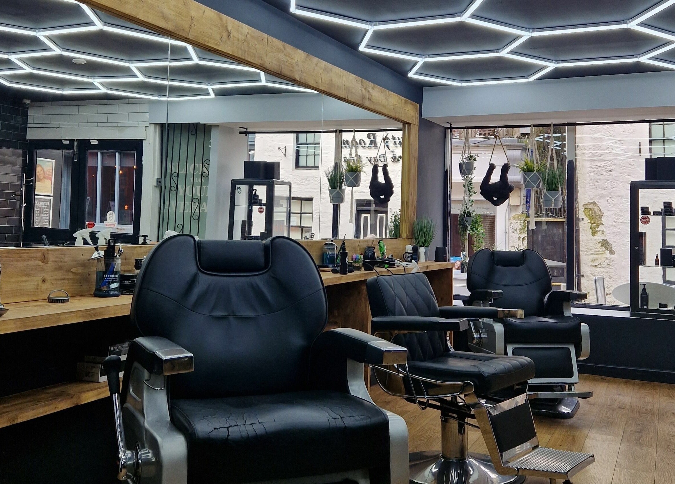 Sleek barber chairs at Uppercut, Kilsyth, Scotland, GB, showcasing contemporary interior design.