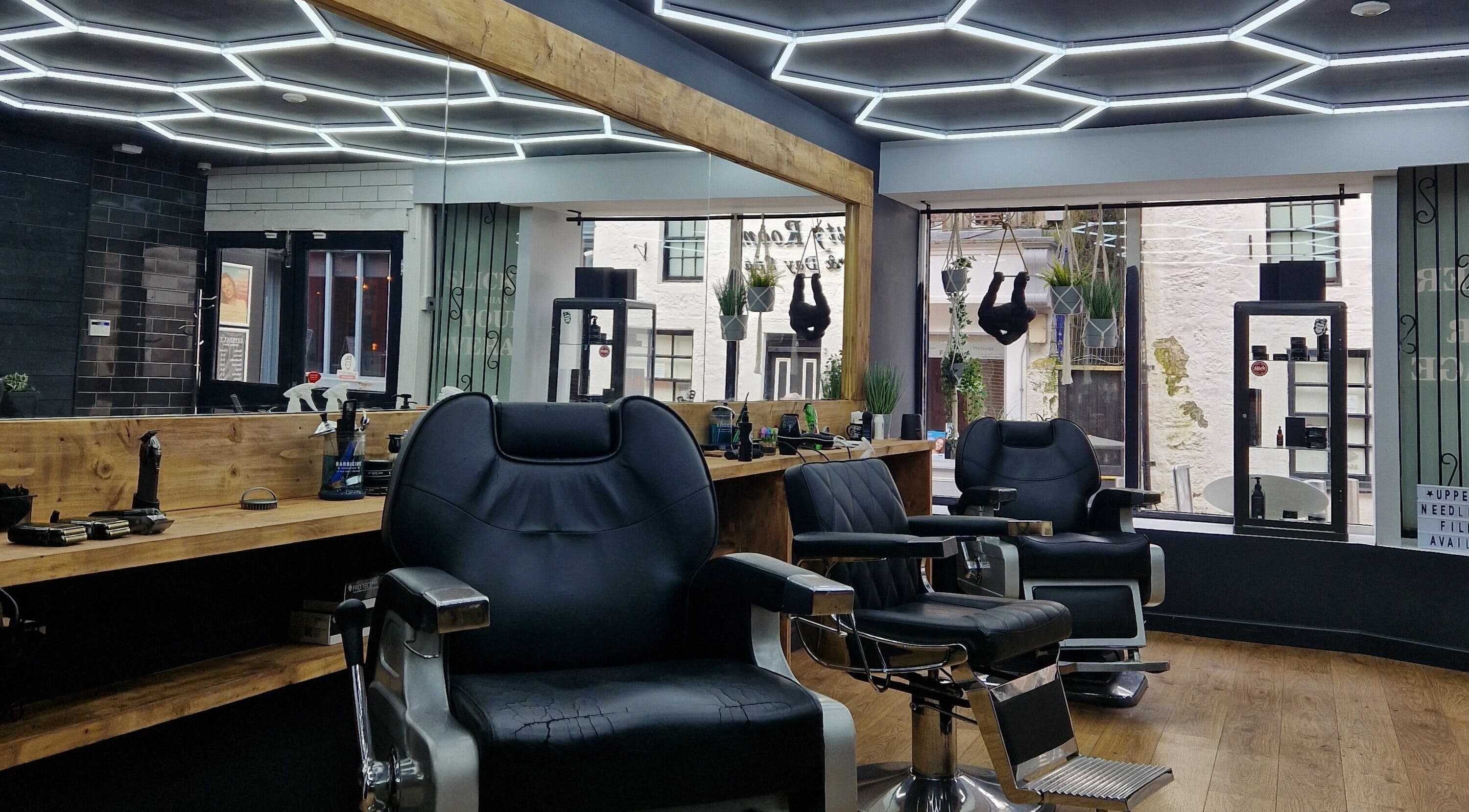 Sleek barber chairs at Uppercut, Kilsyth, Scotland, GB, showcasing contemporary interior design.