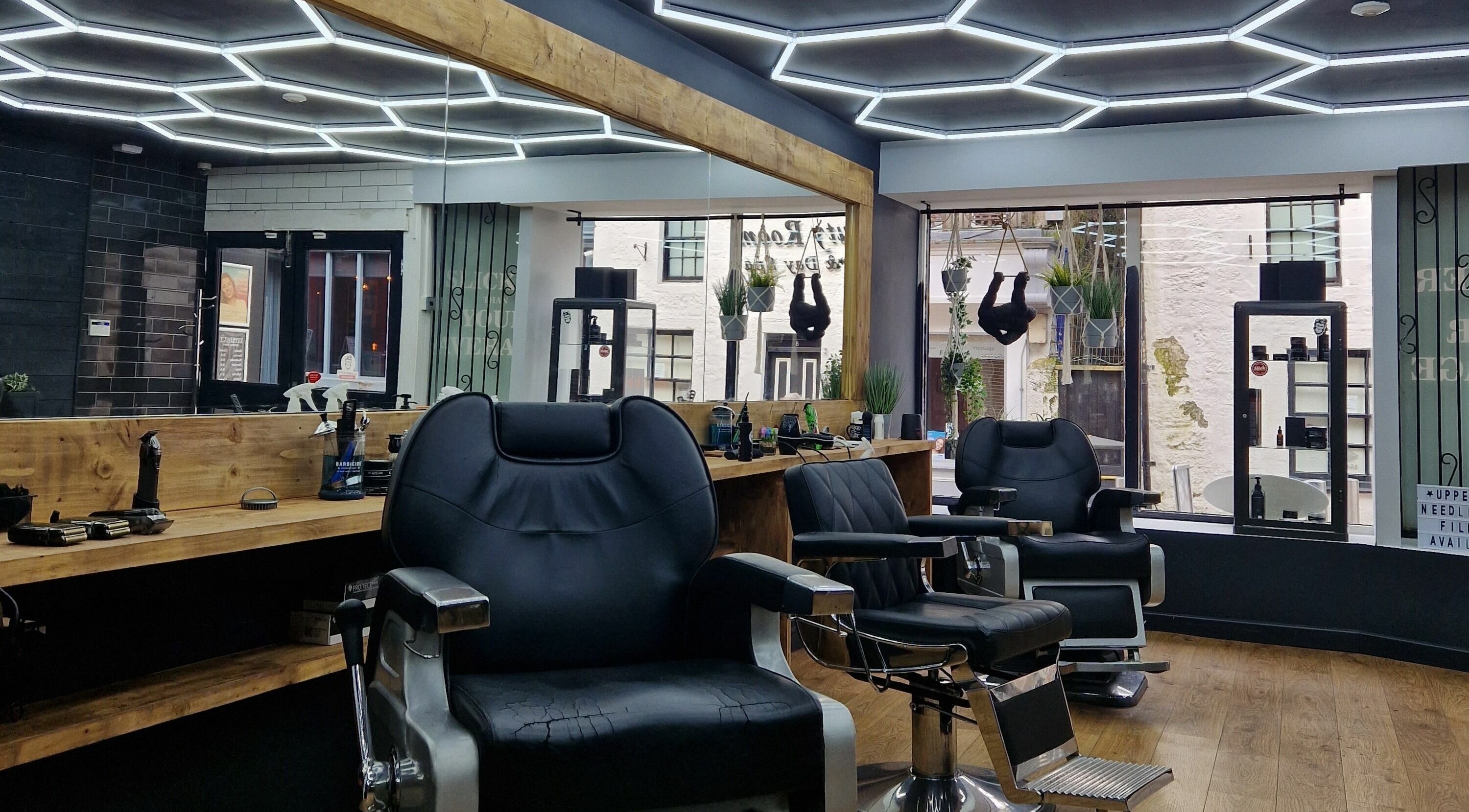 Sleek barber chairs at Uppercut, Kilsyth, Scotland, GB, showcasing contemporary interior design.