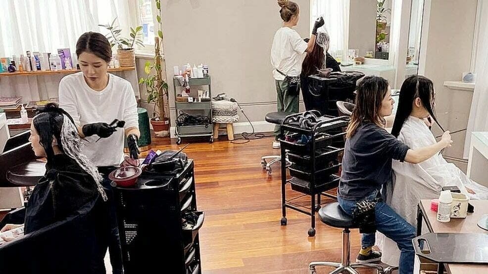 Stylists at Alpha Japanese Hair Salon in Haymarket, NSW, AU, providing exceptional hair care services.