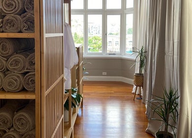 Interior view of Alpha Japanese Remedial Massage in Haymarket, New South Wales, AU showcasing wooden decor and soft lighting.