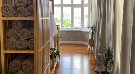 Interior view of Alpha Japanese Remedial Massage in Haymarket, New South Wales, AU showcasing wooden decor and soft lighting.