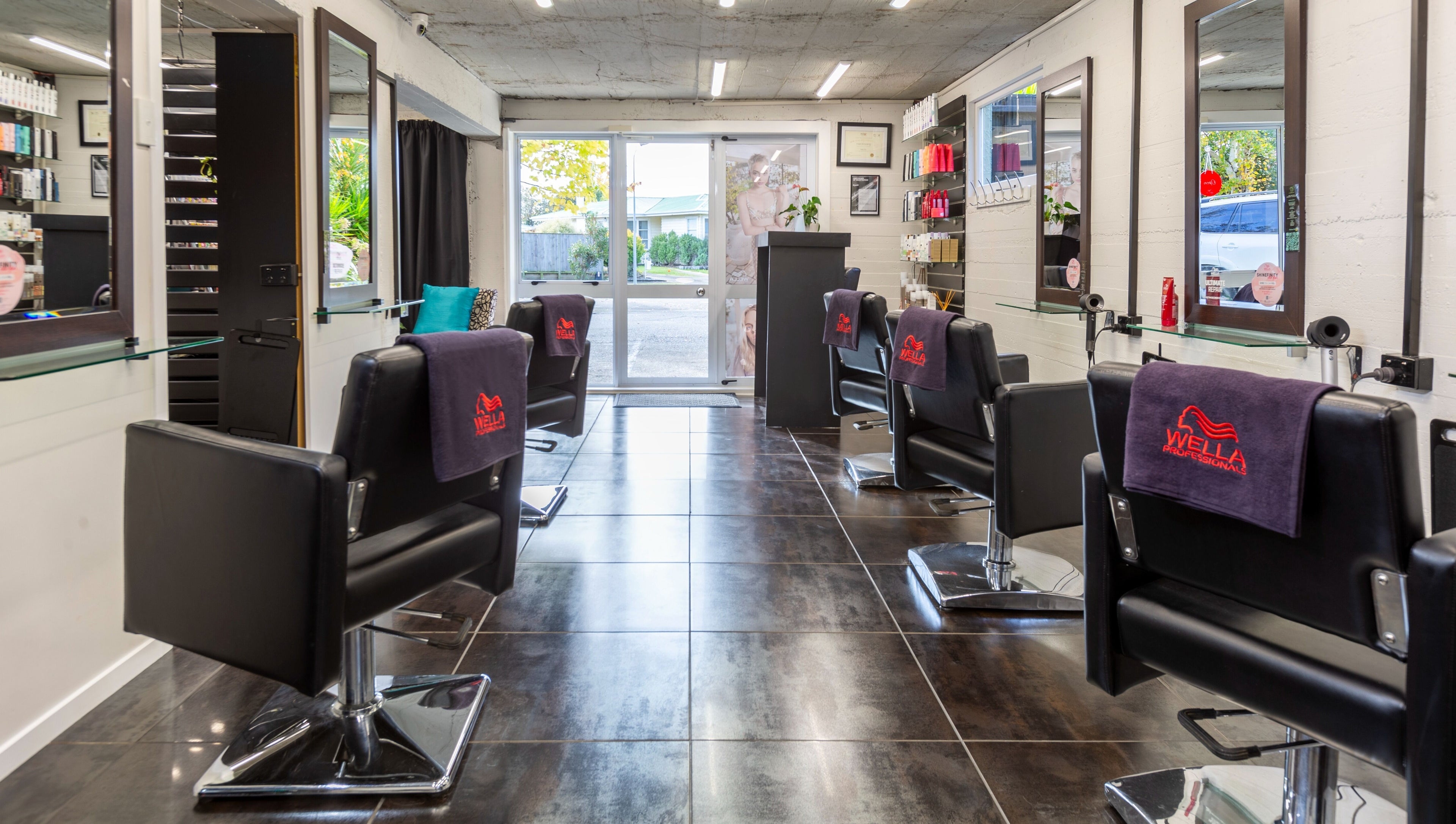 Elegant salon at Sphere in Palmerston North, Manawatu-Wanganui, NZ with sleek chairs and modern decor.