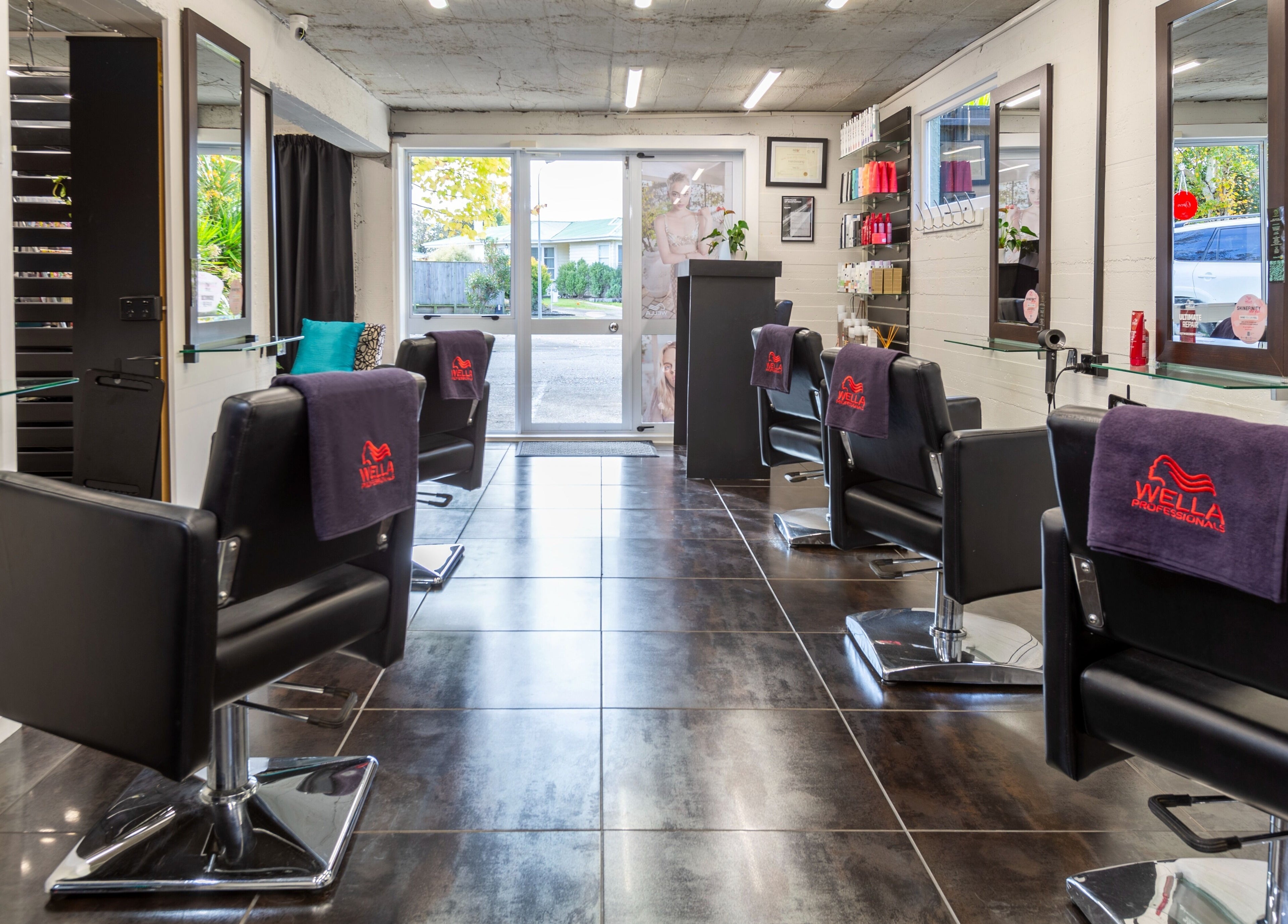 Elegant salon at Sphere in Palmerston North, Manawatu-Wanganui, NZ with sleek chairs and modern decor.