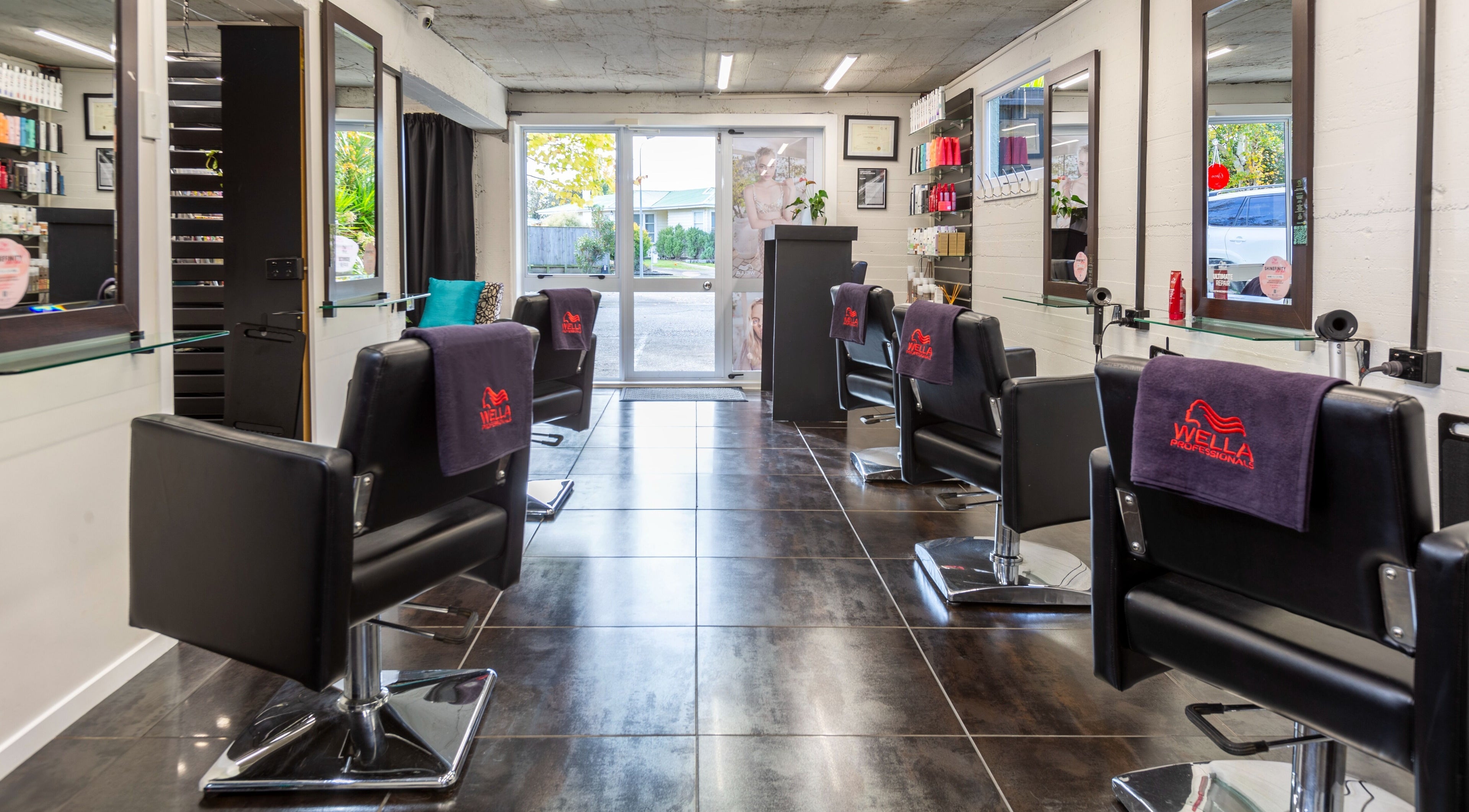 Elegant salon at Sphere in Palmerston North, Manawatu-Wanganui, NZ with sleek chairs and modern decor.