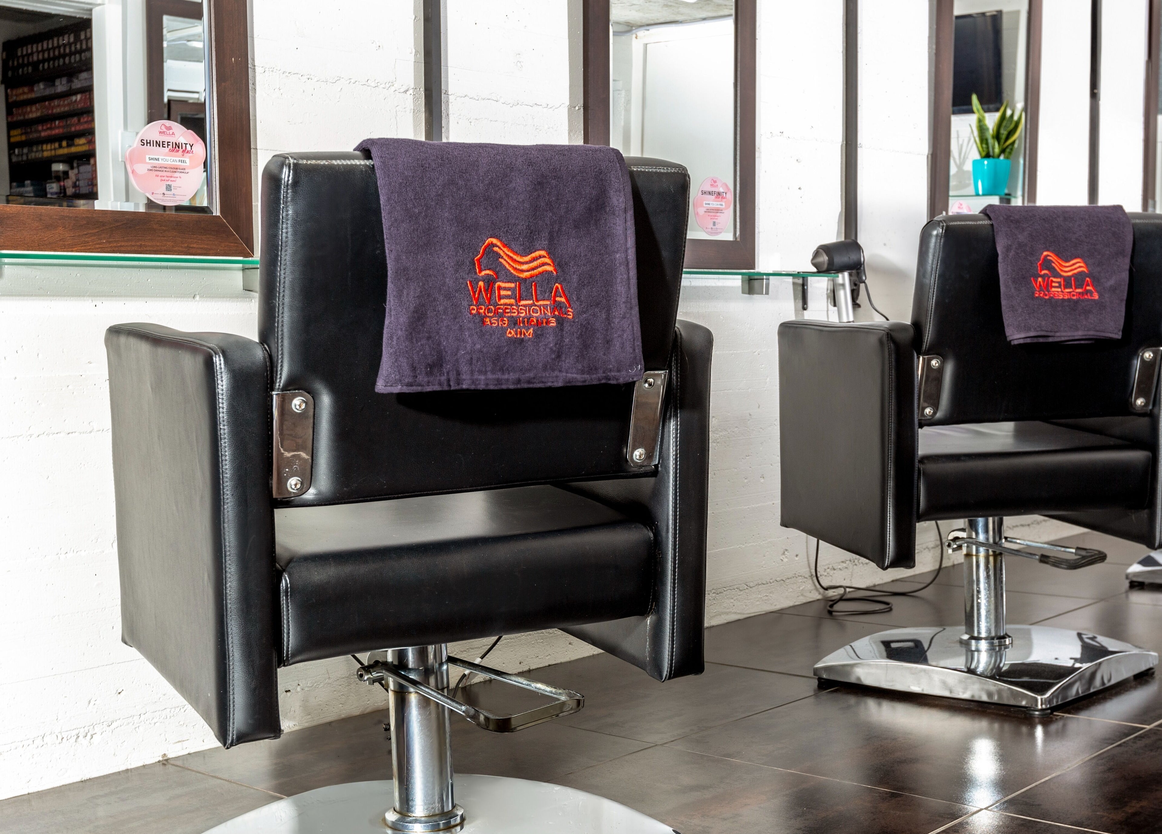 Modern salon chairs at Sphere, Palmerston North, Manawatu-Wanganui, NZ offering premium beauty services.