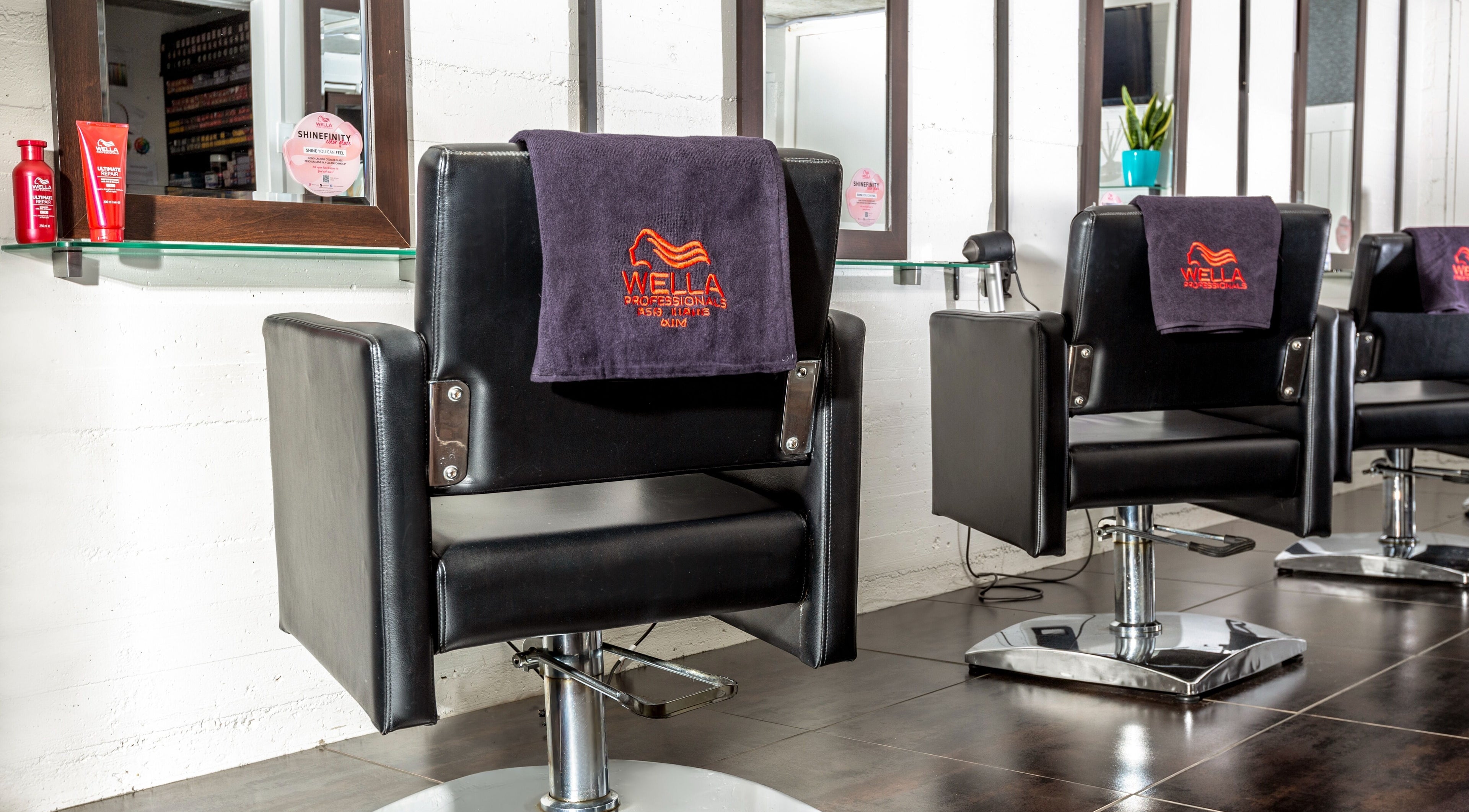 Modern salon chairs at Sphere, Palmerston North, Manawatu-Wanganui, NZ offering premium beauty services.
