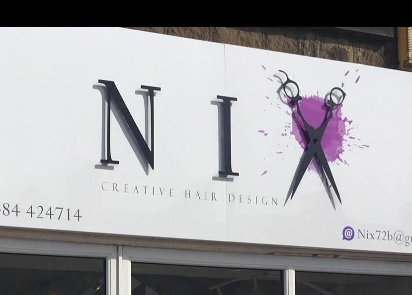 Nix Creative Hair Design signage at Huddersfield, England, GB showcasing scissors icon and contact details.