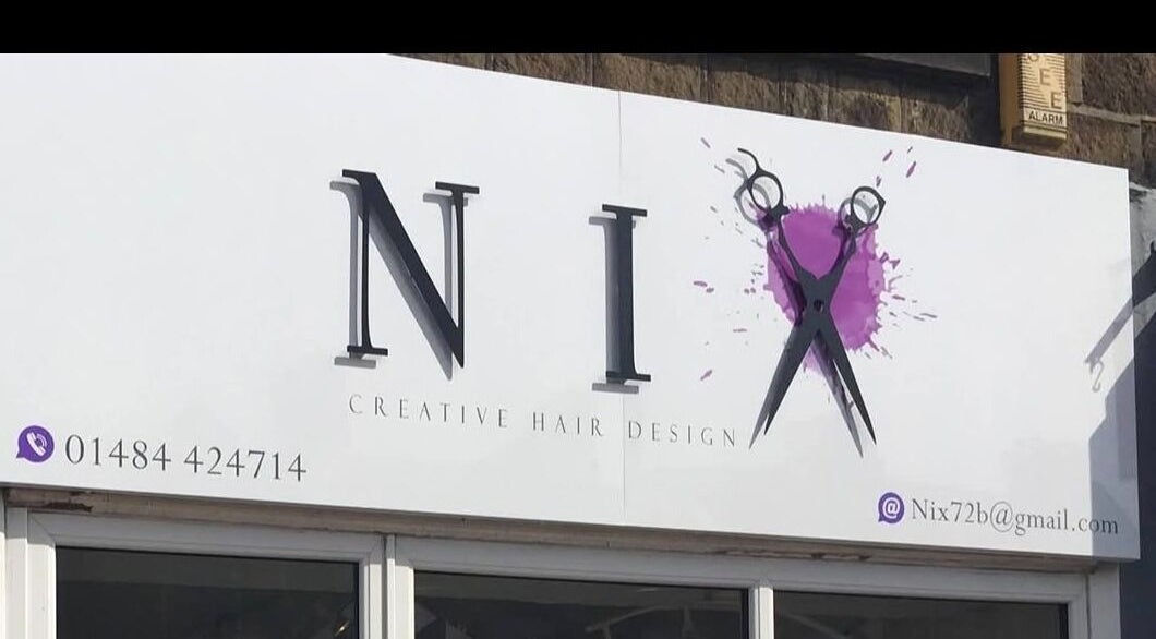 Nix Creative Hair Design signage at Huddersfield, England, GB showcasing scissors icon and contact details.
