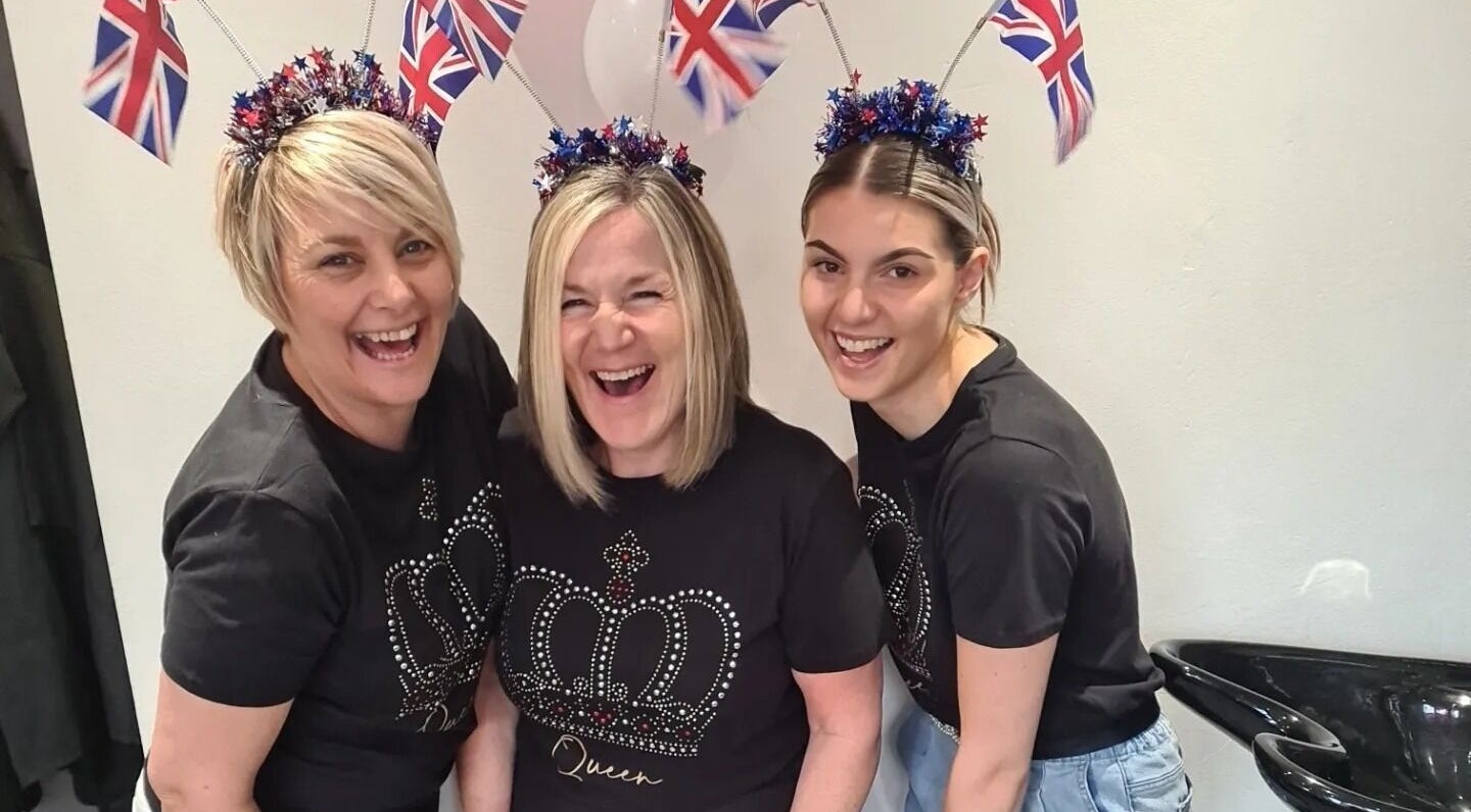 Team at Nix Creative Hair Design, Huddersfield, England, GB, celebrating with joy and Union Jack decorations.
