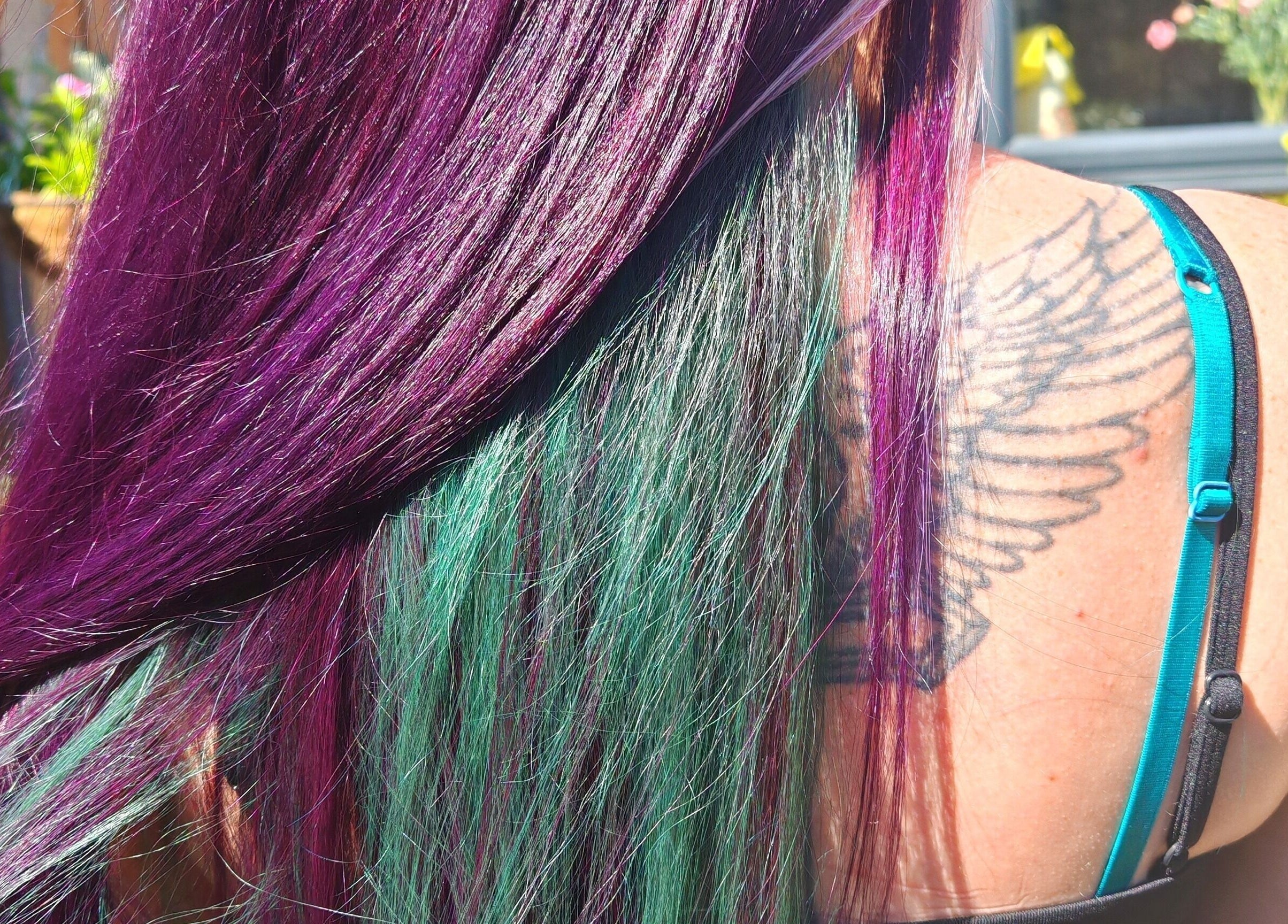 Vibrant purple and green hair styled at Dannielle's Cutting Edge, Littlestone, England, GB.