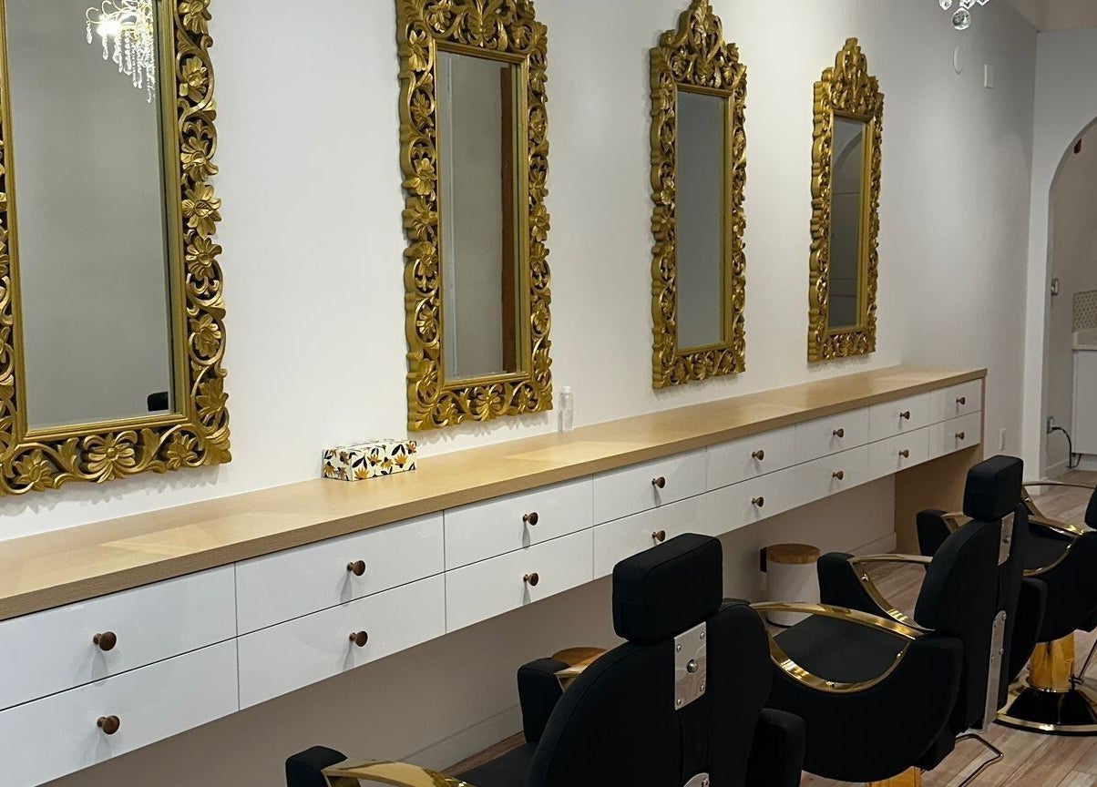 Elegant interior of Panache Brow House Gastown, Vancouver, BC, with ornate mirrors and salon chairs.