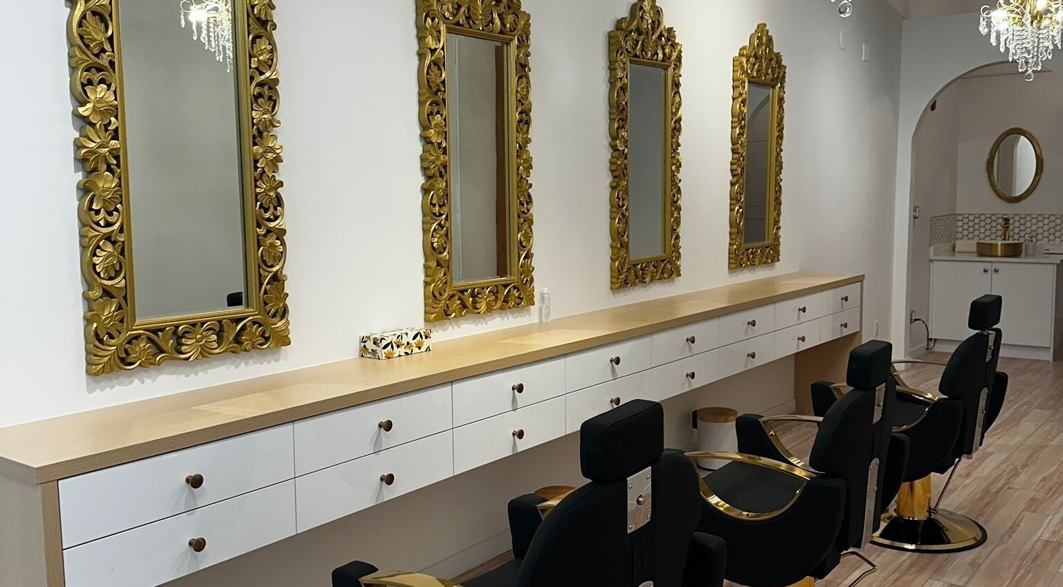 Elegant interior of Panache Brow House Gastown, Vancouver, BC, with ornate mirrors and salon chairs.
