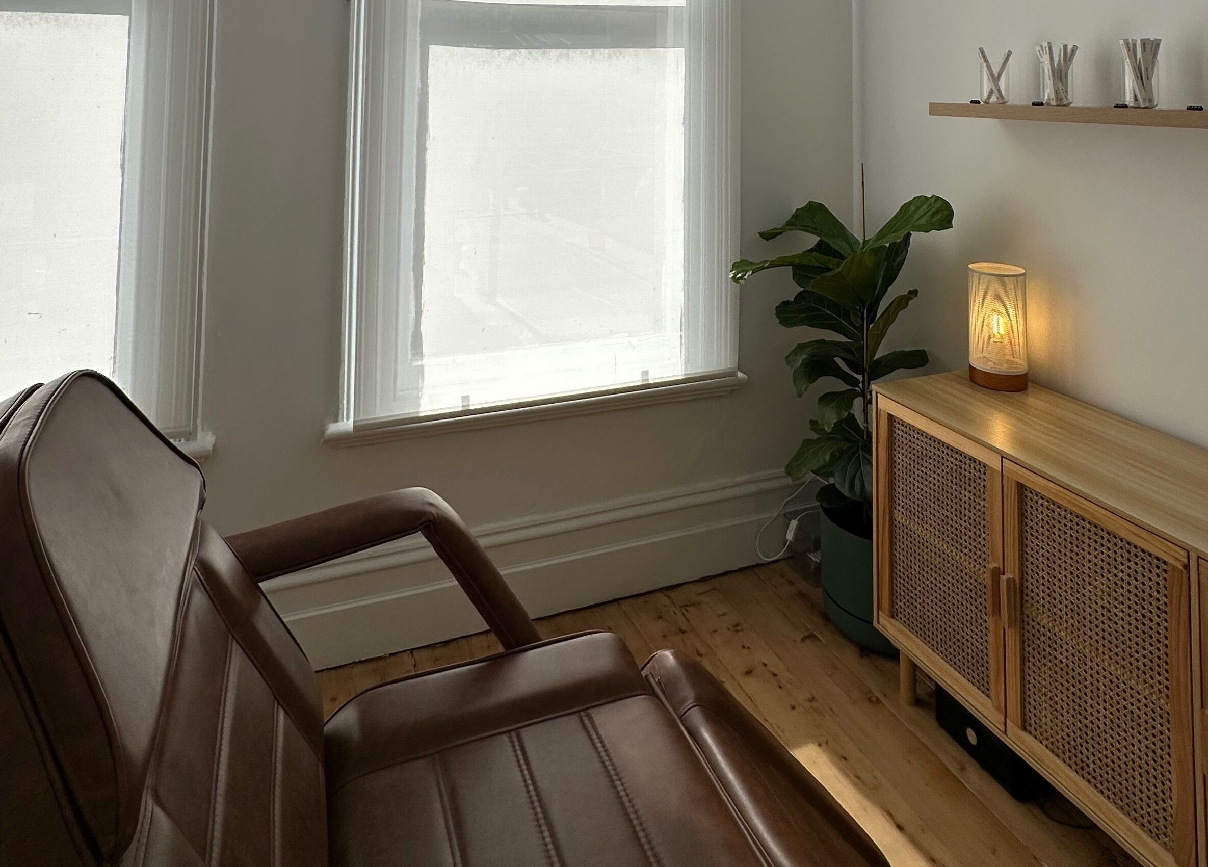 Relaxing beauty room at Néktar Studio, Melbourne, Victoria, AU with cozy chair and natural decor.