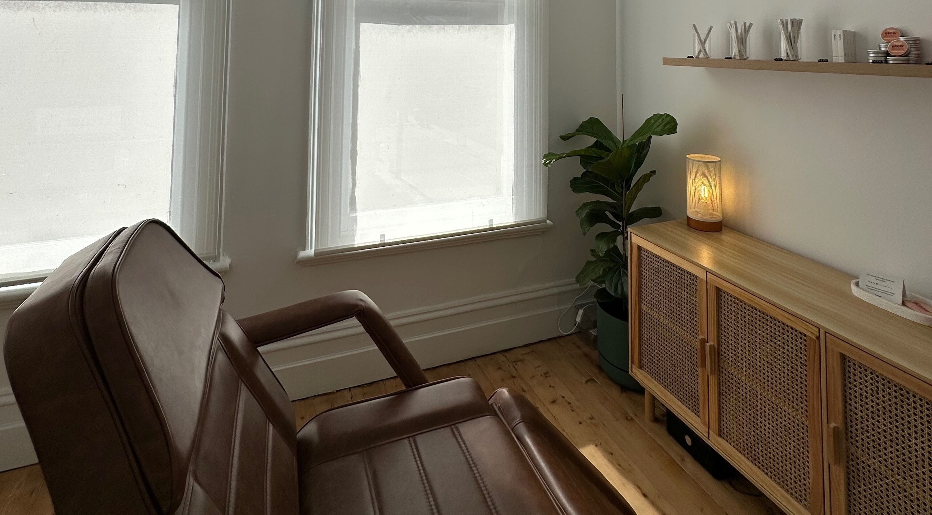 Relaxing beauty room at Néktar Studio, Melbourne, Victoria, AU with cozy chair and natural decor.