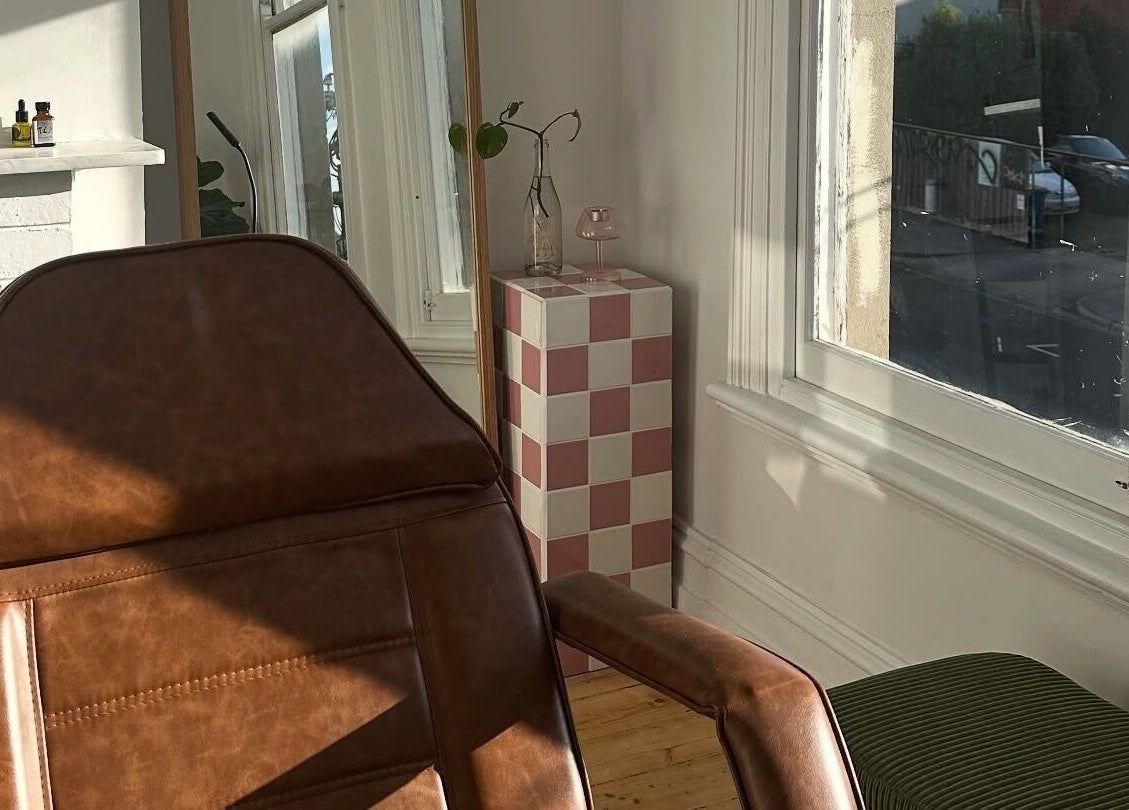 Cozy chair near window at Néktar Studio, Melbourne, Victoria, AU. Inviting wellness ambiance.