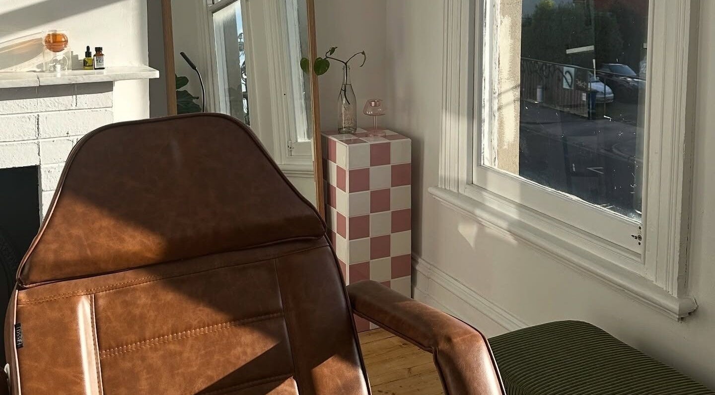 Cozy chair near window at Néktar Studio, Melbourne, Victoria, AU. Inviting wellness ambiance.