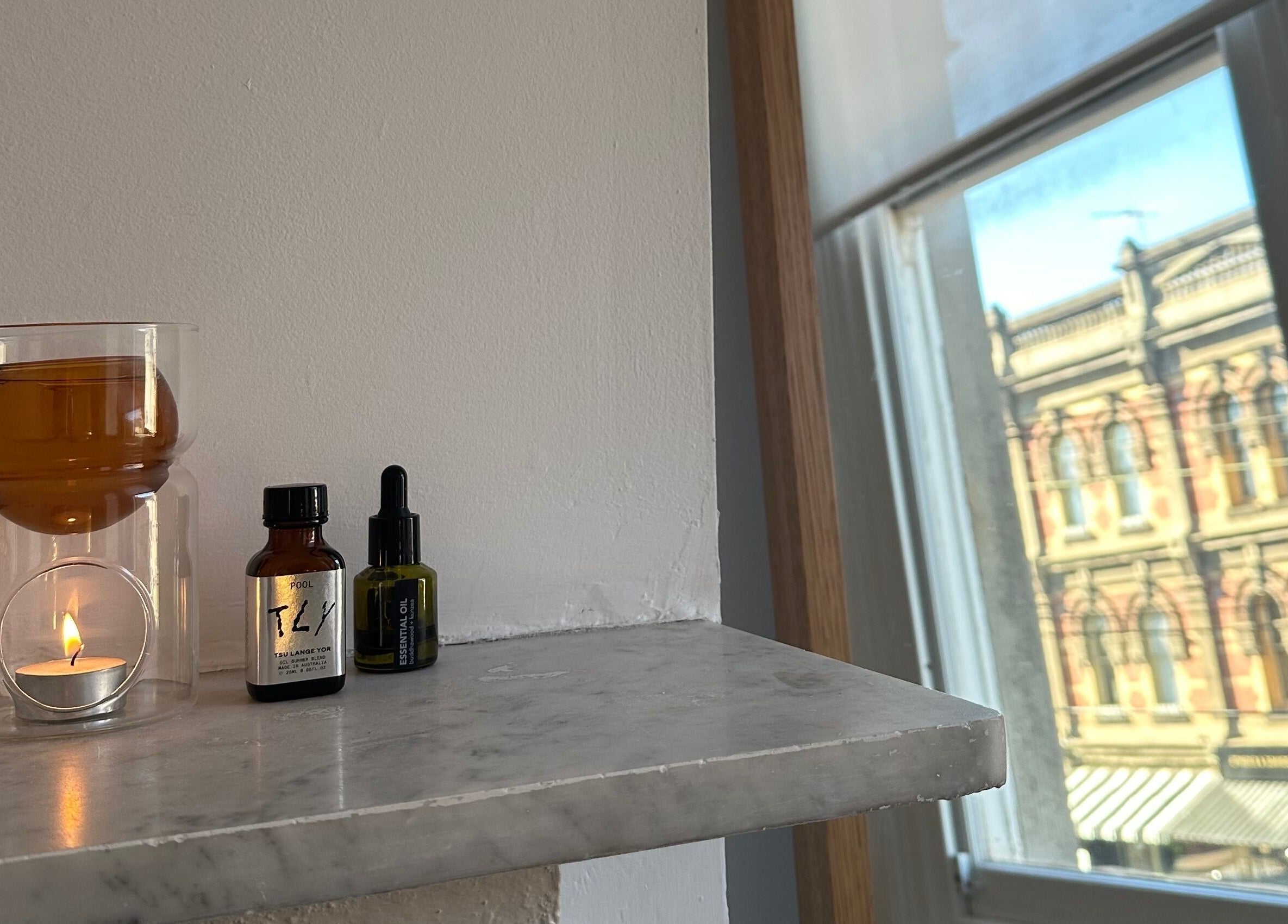 Aromatherapy setup with candle and oils at Néktar Studio, Melbourne, Victoria, AU enhancing relaxation ambiance.