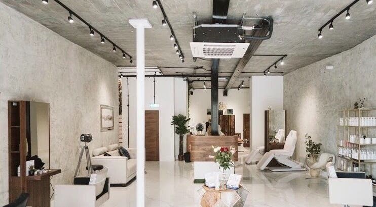 Modern beauty salon interior of Laura Louise in London, England, GB with stylish decor and treatment chairs.