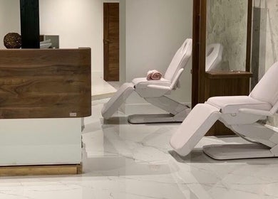 Modern and inviting wellness space at Laura Louise in London, England, GB featuring stylish recliner chairs.