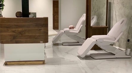 Modern and inviting wellness space at Laura Louise in London, England, GB featuring stylish recliner chairs.