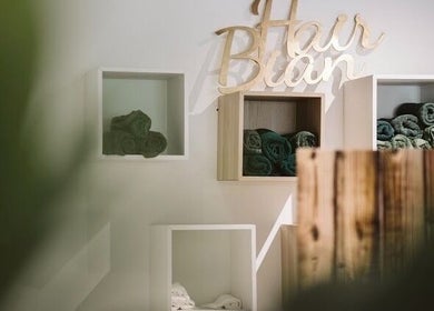 Elegant towel display at Laura Louise, London, England, GB. Aesthetic cubbies and wooden decor detail.