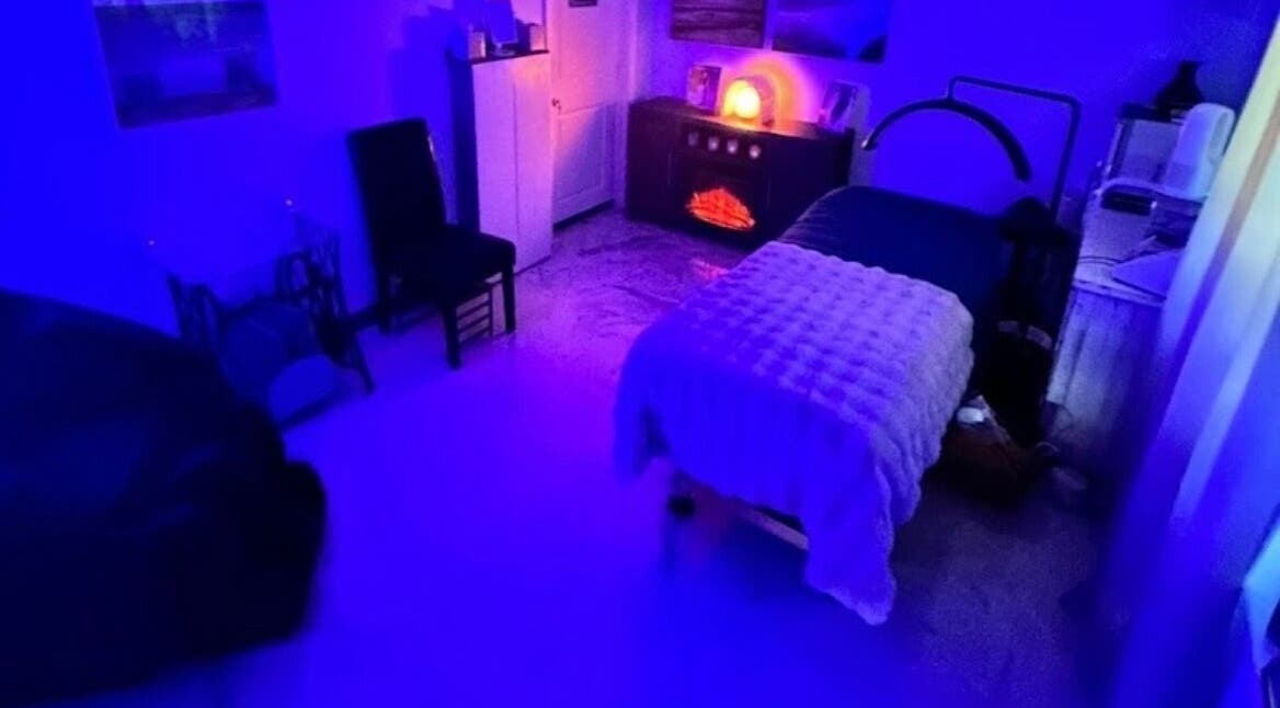 Relaxing blue-lit room at Skintastic Skin Care’s Lake Side Escape, Raymond, New Hampshire, US.