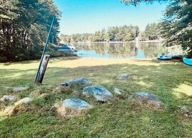 Relaxing lakeside view at Skintastic Skin Care’s Lake Side Escape in Raymond, New Hampshire, US.