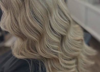 Elegant blonde waves styled at Ellhaircabin, Derby, England, GB showcasing professional hair craftsmanship.
