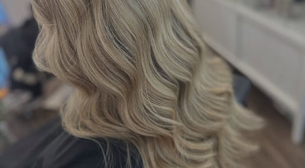 Elegant blonde waves styled at Ellhaircabin, Derby, England, GB showcasing professional hair craftsmanship.
