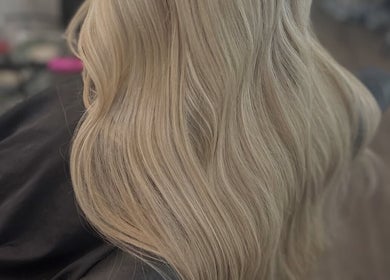 Blonde hair styled in soft waves at Ellhaircabin, Derby, England, GB.