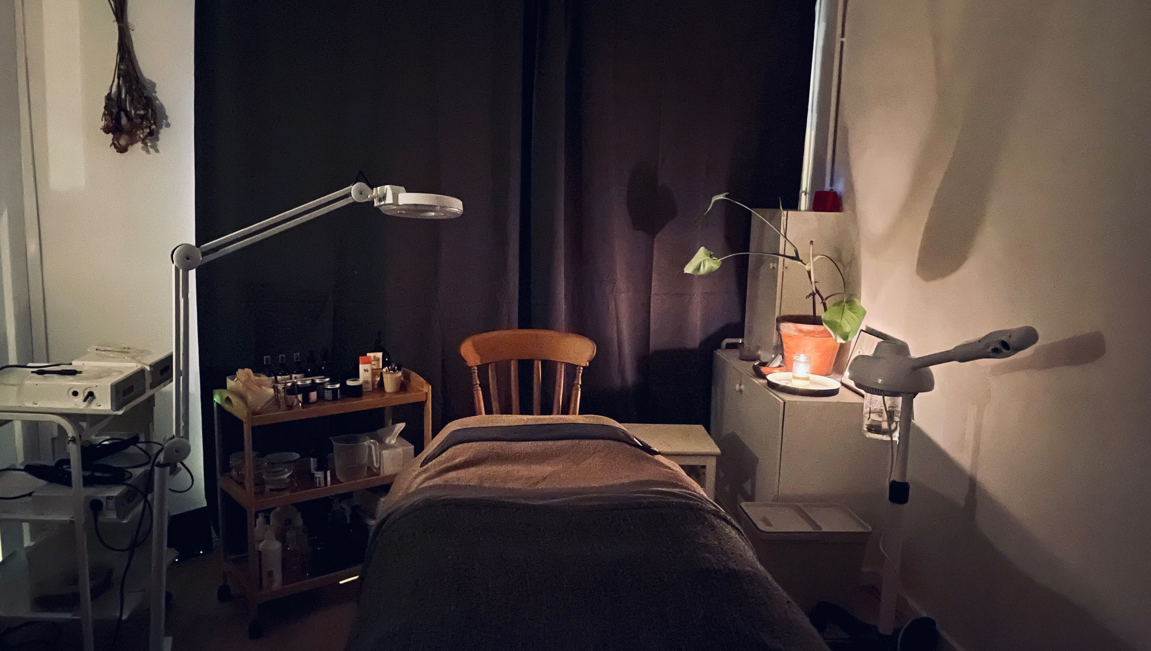Calm interior of Little Rest Skin Treatment Room, Birmingham, England, GB, featuring a treatment table and ambient lighting.
