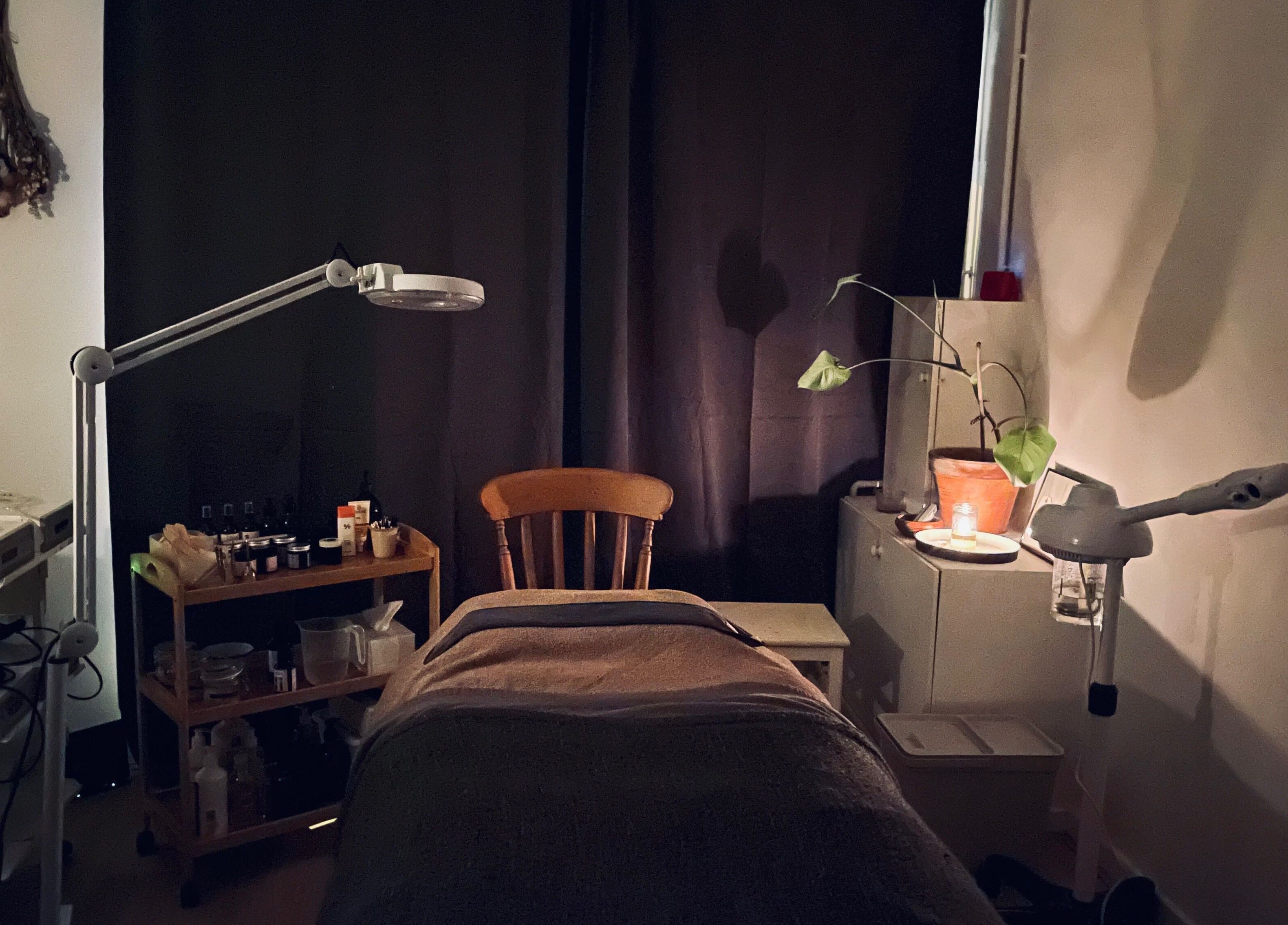 Calm interior of Little Rest Skin Treatment Room, Birmingham, England, GB, featuring a treatment table and ambient lighting.