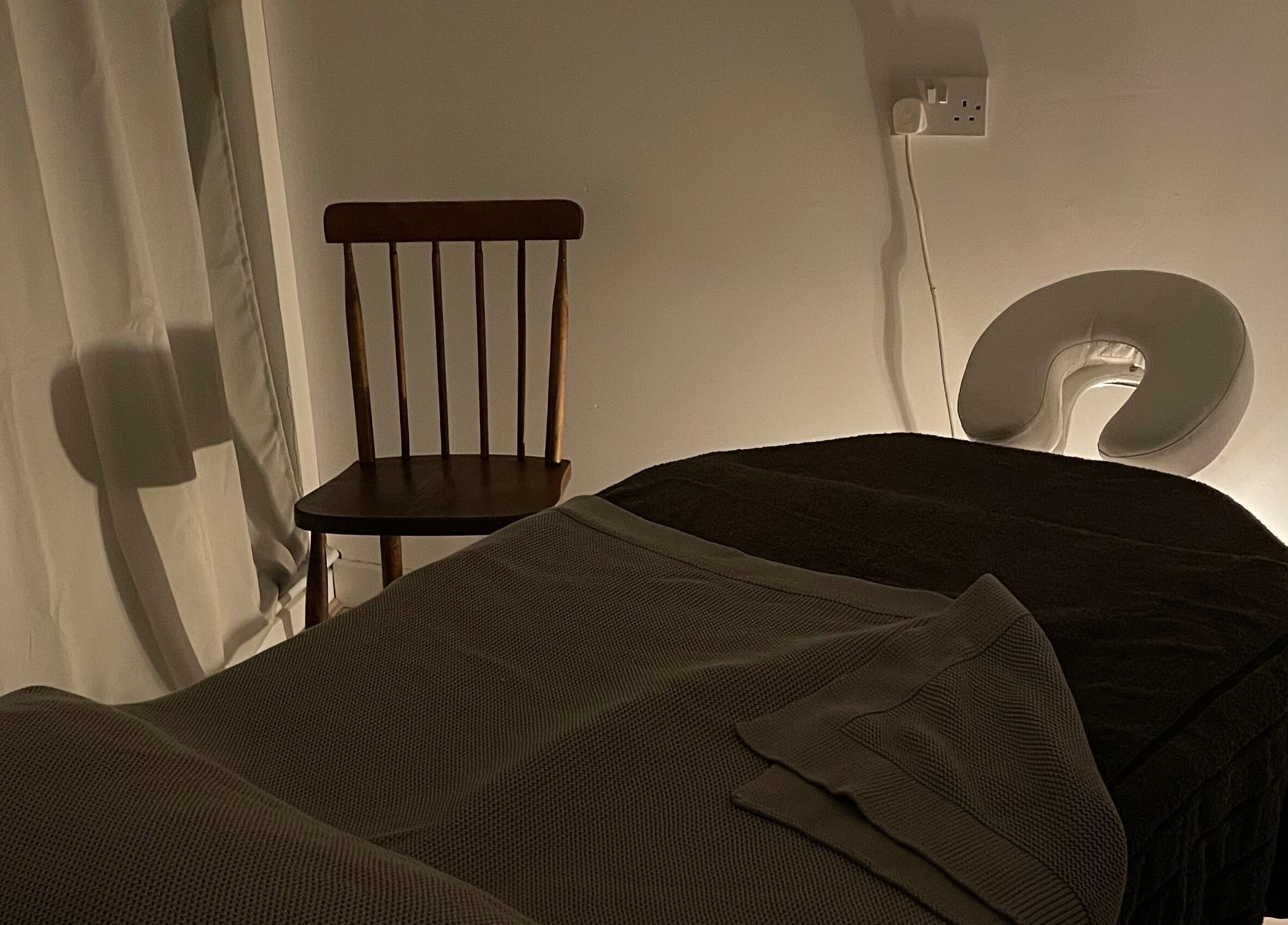 Tranquil treatment room at Little Rest Skin Treatment Room, Birmingham, England, GB, with a massage table.