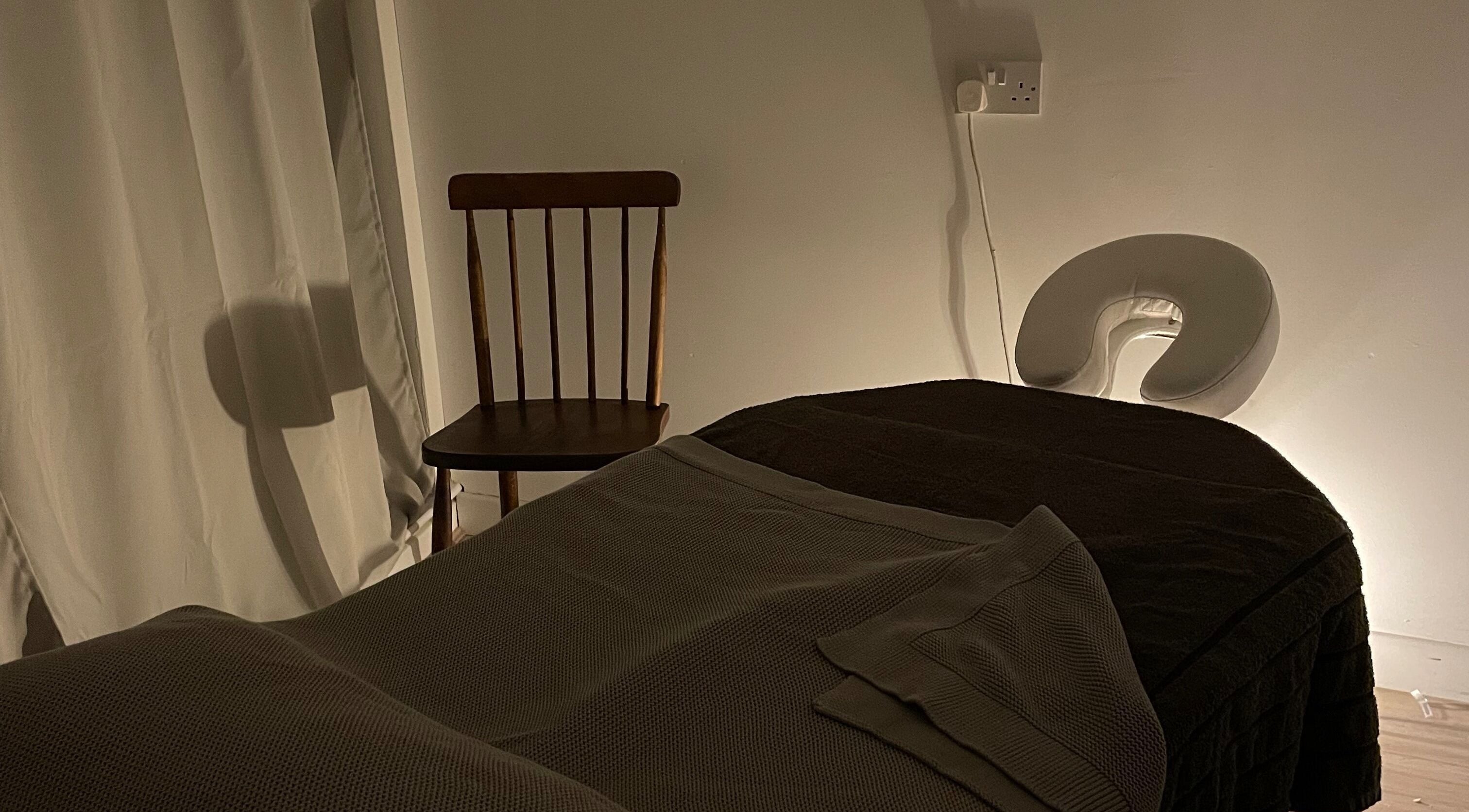 Tranquil treatment room at Little Rest Skin Treatment Room, Birmingham, England, GB, with a massage table.