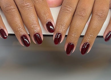 Stylish dark red manicure at In My Gel Era, Narwee, New South Wales, AU. Shiny, chic nails enhance beauty.