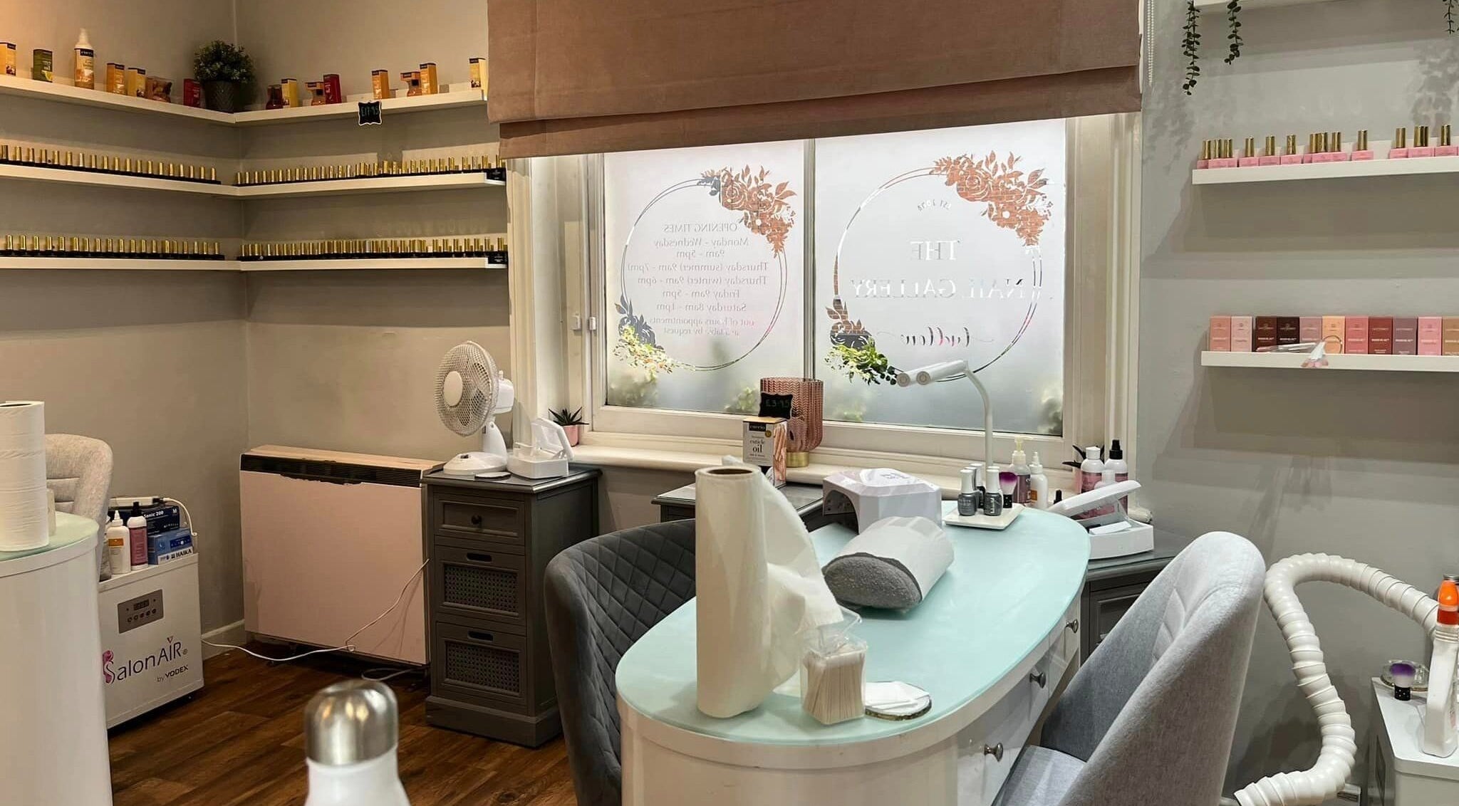 A cozy interior of The Nail Gallery in Ludlow, England, GB showcasing a stylish and well-equipped nail salon.