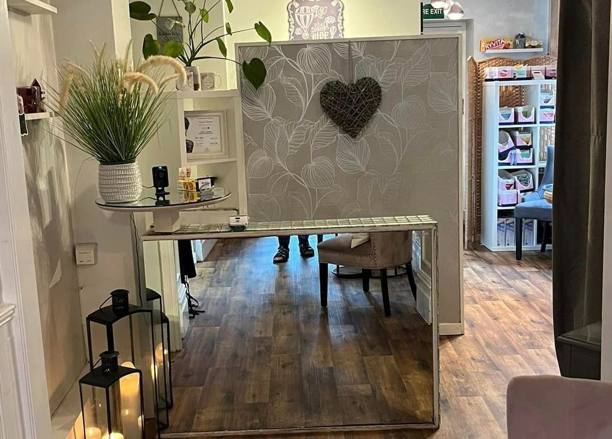 Elegant entryway with decor at The Nail Gallery, Ludlow, England, GB, showcasing soft lighting and modern style.