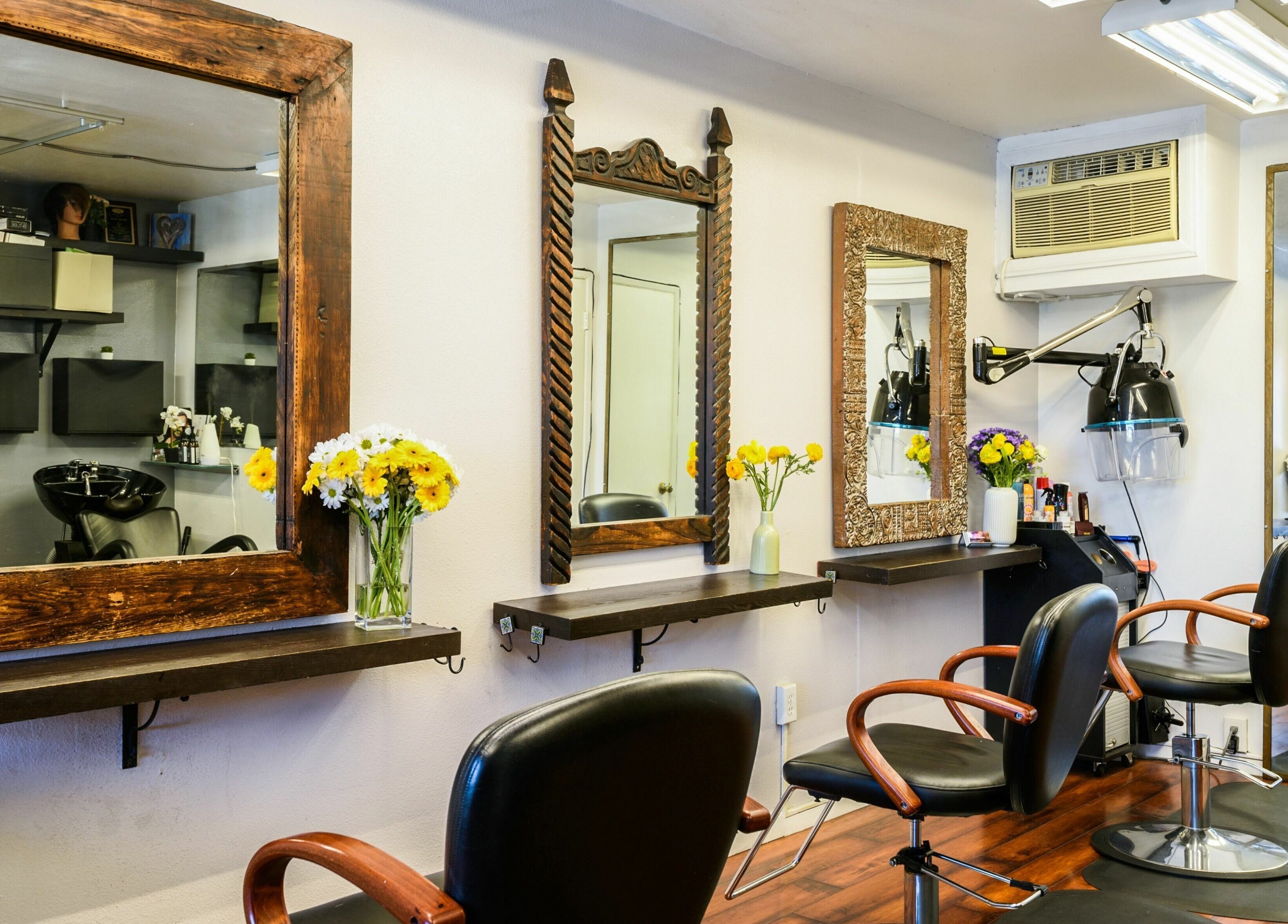 Chic interior of Mud Honey Salon in Manhattan Beach, California, US with elegant styling stations.