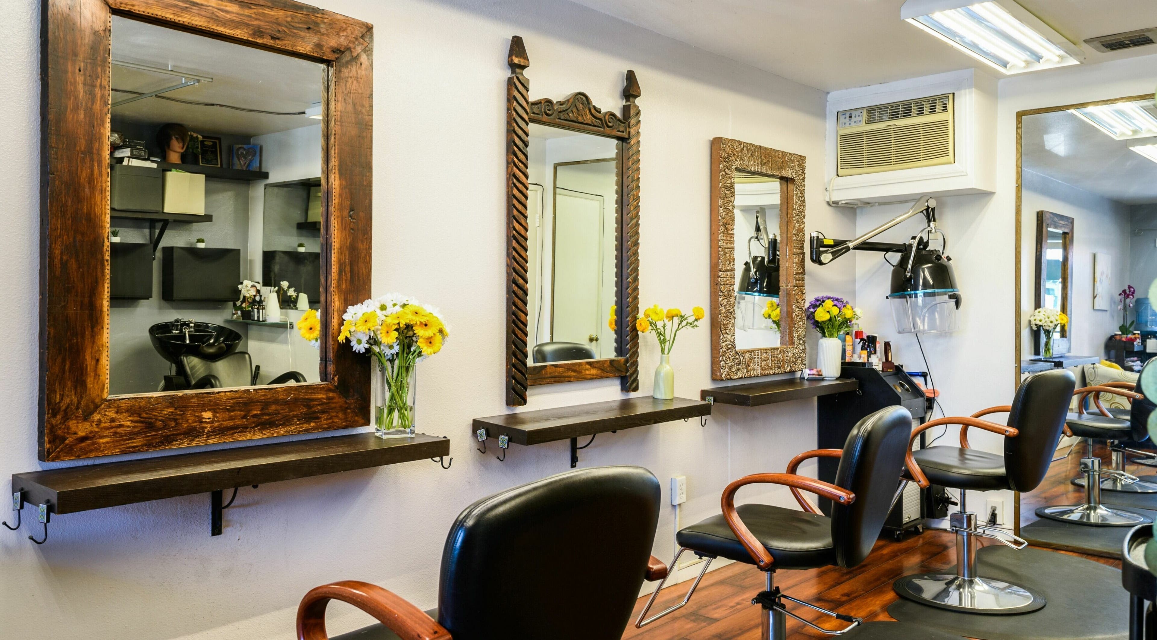 Chic interior of Mud Honey Salon in Manhattan Beach, California, US with elegant styling stations.