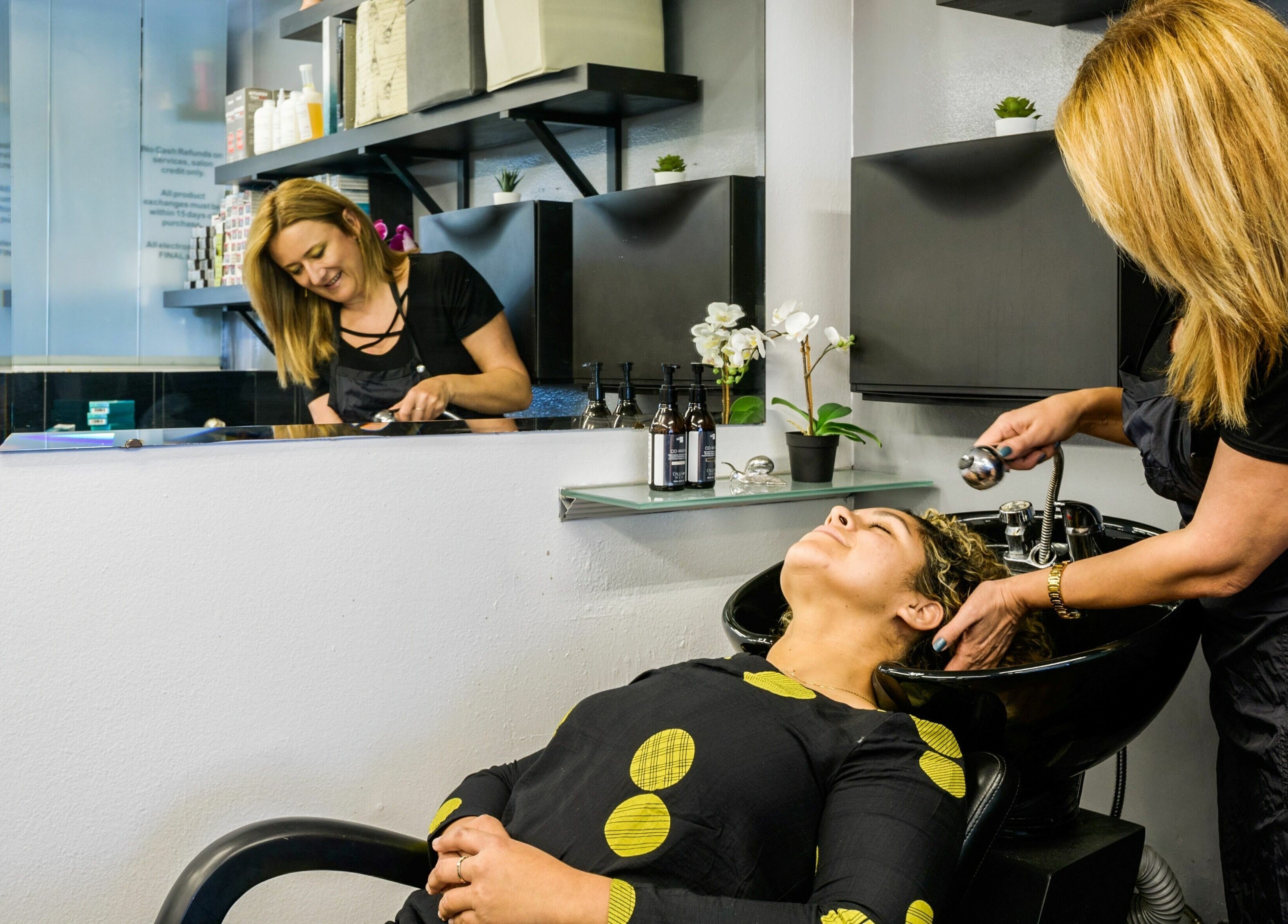 Relaxing hair wash at Mud Honey Salon, Manhattan Beach, California, US with professional stylist care.