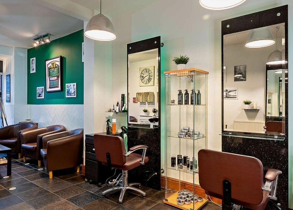 Modern salon interior at Daniel Antony, Northampton, England, GB, featuring stylish chairs and beauty products.