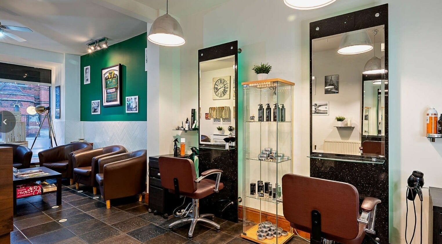 Modern salon interior at Daniel Antony, Northampton, England, GB, featuring stylish chairs and beauty products.