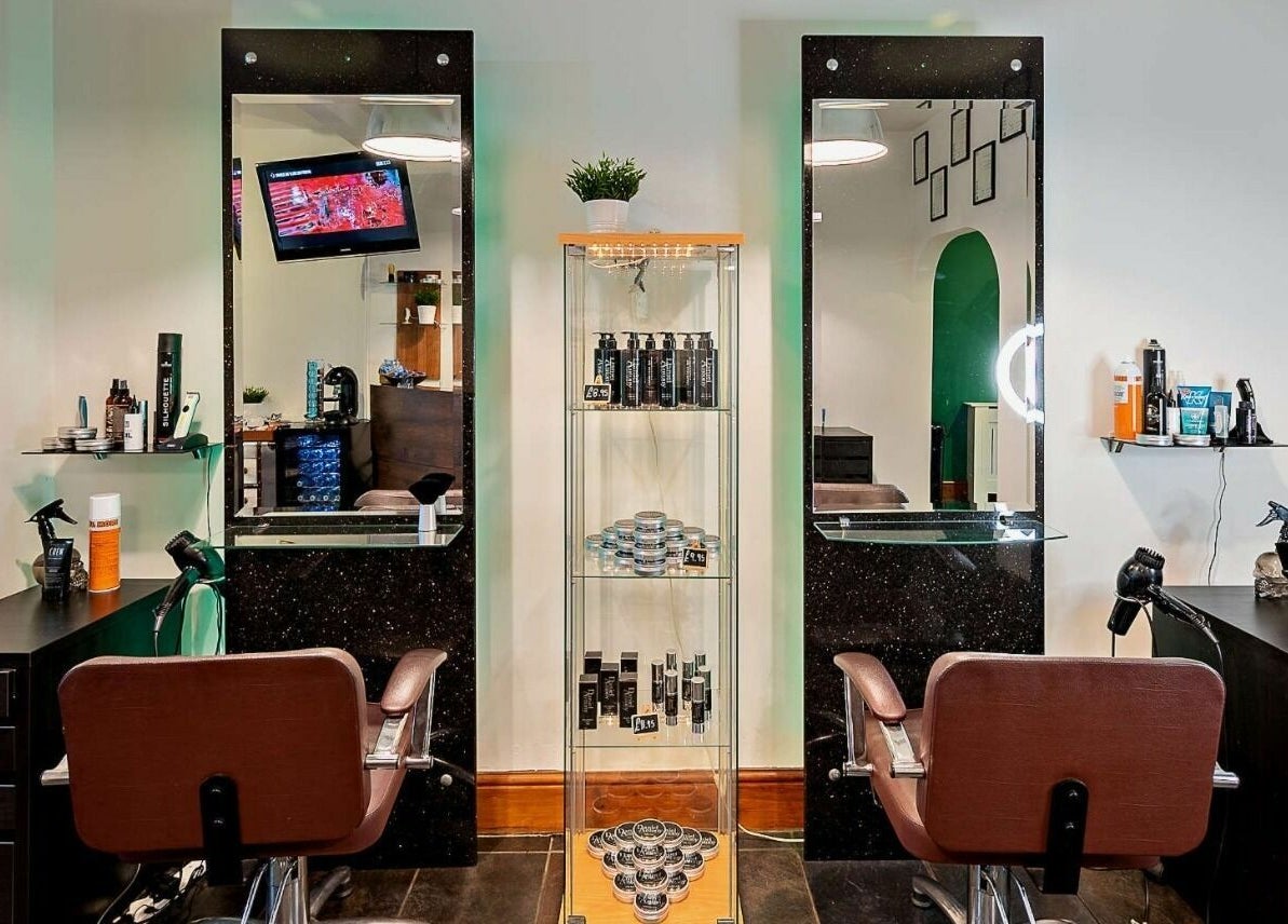 Elegant salon chairs and mirrors at Daniel Antony, Northampton, England, GB, showcasing modern beauty services.