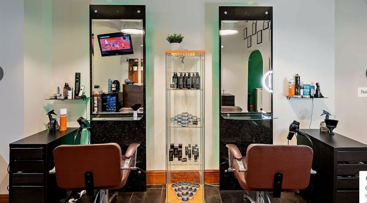 Elegant salon chairs and mirrors at Daniel Antony, Northampton, England, GB, showcasing modern beauty services.