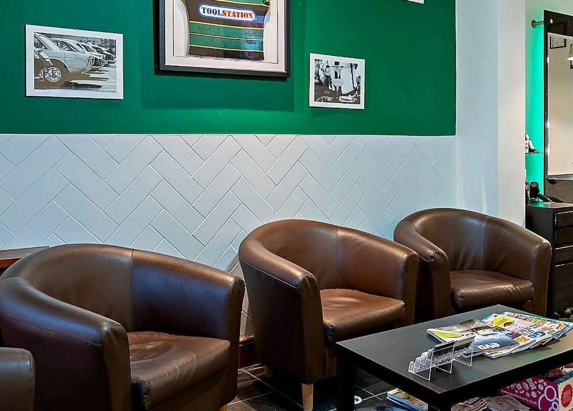 Stylish seating area at Daniel Antony, Northampton, England, GB with modern decor and comfortable armchairs.