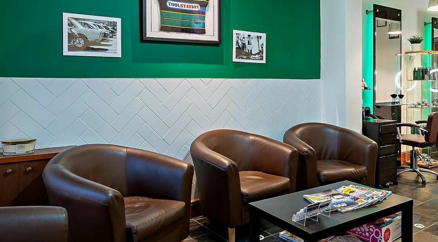 Stylish seating area at Daniel Antony, Northampton, England, GB with modern decor and comfortable armchairs.