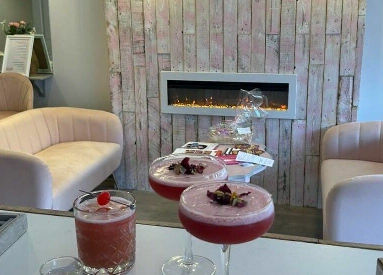 Elegant seating area at Lash & Co, Fleetwood, England, GB with beige sofas and stylish drinks.