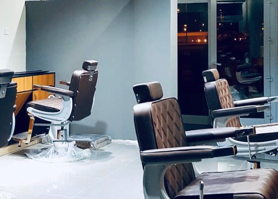 Modern barber chairs at The Clippers, Cluster Q, JLT in Dubai, Dubai, AE, showcasing luxurious salon interior.